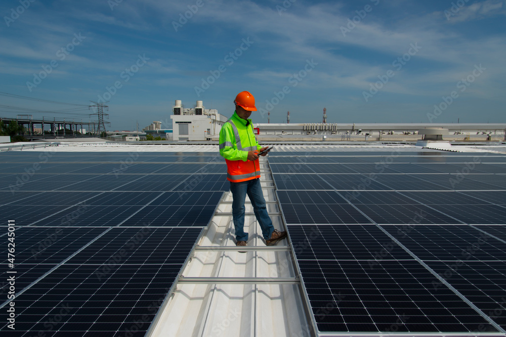 Technology solar cell, Engineer service check installation solar cell on the roof of factory. technician inspection and repair solar cell on the roof of factory.