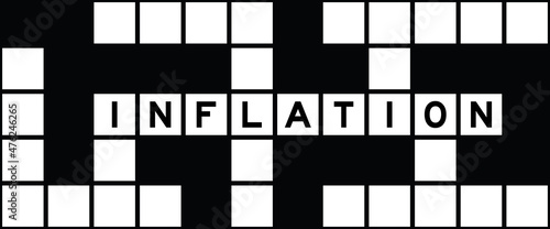 Alphabet letter in word inflation on crossword puzzle background