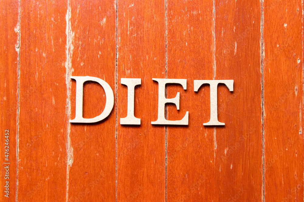 Alphabet letter in word diet on old red color wood plate background Alphabet letter in word diet on old red color wood plate background