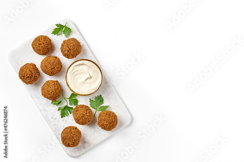 Chickpeas falafel with tahini sauce. Top view, copy space photo