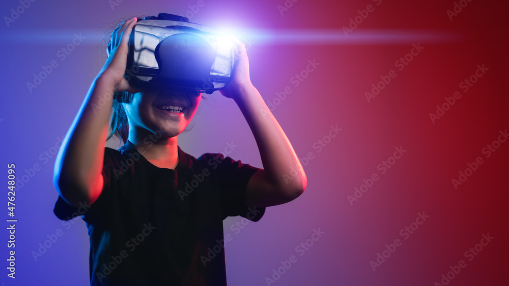 happy girl in glasses of virtual reality. Augmented reality, science, future technology concept. VR. Futuristic 3d glasses with virtual projection. Neon light. happy girl in glasses of virtual reality. Augmented reality, science, future technology concept. VR. Futuristic 3d glasses with virtual projection. Neon light.