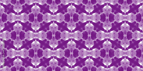 Beautiful tie-dye background. Abstract purple stains on the white fabric.	
