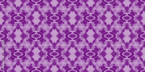 Beautiful tie-dye background. Abstract purple stains on the white fabric. 