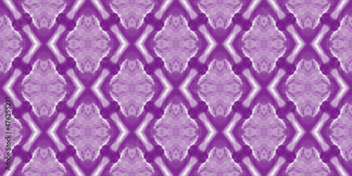 Beautiful tie-dye background. Abstract purple stains on the white fabric.	