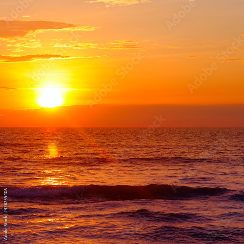 Sea and bright sun set. A tropical beach for relaxation and travel. © alinamd