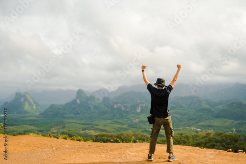 new normal outdoor lifestyle of man during travel on mountain with happy and successful feeling