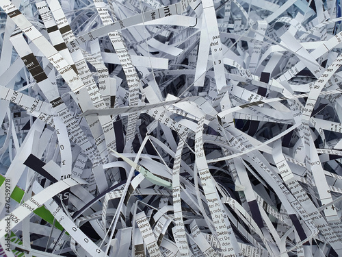 Shredded paper documents background which is garbage waste trash ready for recycling to prevent fraud and identity theft, stock photo image