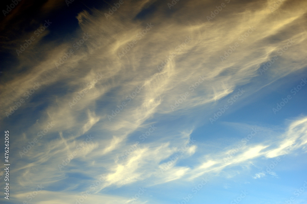 Texture, background: beautiful, colorful cloudy sky at sunset (sunrise). Blue, pink, orange, yellow. Texture, background: beautiful, colorful cloudy sky at sunset (sunrise). Blue, pink, orange, yellow.
