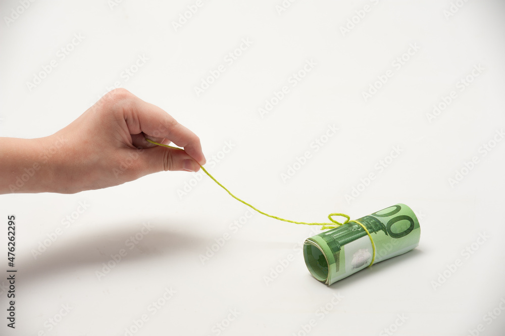 Concept of fishing with money currency as bait or incentive. Concept of fishing with money currency as bait or incentive.