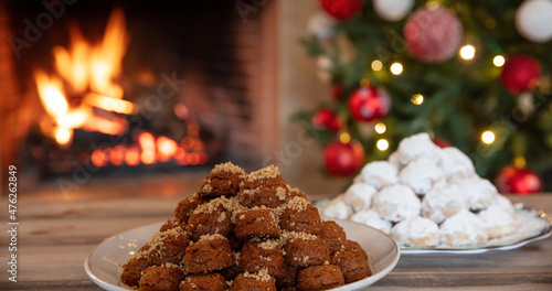Christmas Greek dessert. Traditional homemade melomakarono and kourabies on a wooden table photo