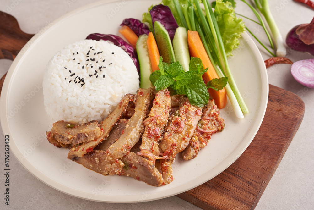 Rice with grilled pork neck. Grilled pork salad thai food with herbs and spices ingredients, tradition northeast food delicious with fresh vegetables, Hot and spicy slice grilled pork menu asian food. Rice with grilled pork neck. Grilled pork salad thai food with herbs and spices ingredients, tradition northeast food delicious with fresh vegetables, Hot and spicy slice grilled pork menu asian food.
