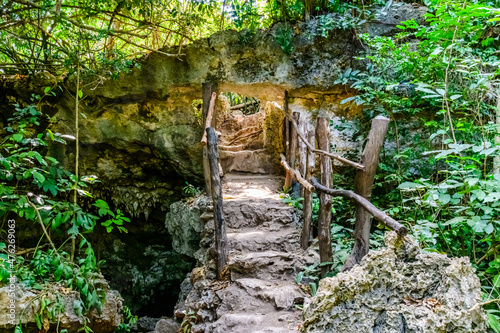 Bridge at entrance to the Kuza cave at Zanzibar, Tanzania photo