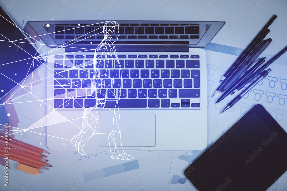 Start up theme drawing over computer on the desktop background. Top view. Double exposure. Brainstorm concept. Start up theme drawing over computer on the desktop background. Top view. Double exposure. Brainstorm concept.