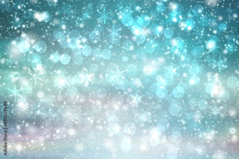 Abstract blurred festive winter christmas or Happy New Year background with shiny blue and white bokeh lighted snow landscape with sky. Space.