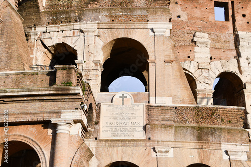 Detail of Latin written on the wall of Colosseo Rome Italy photo