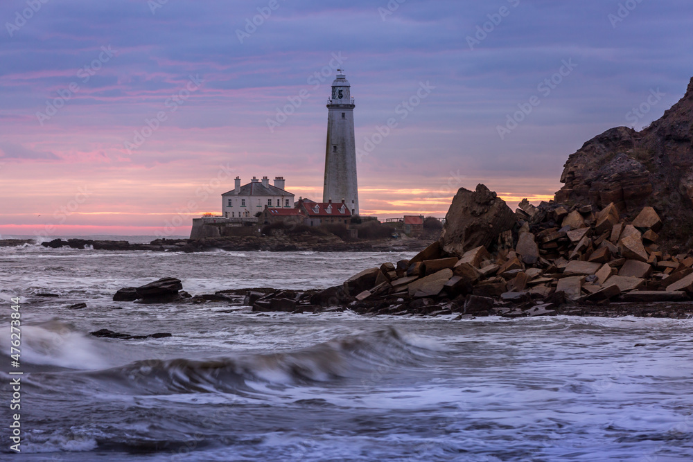 A spectacular sunrise at St Mary's Lighthouse in Whitley Bay, as the sky erupts in color