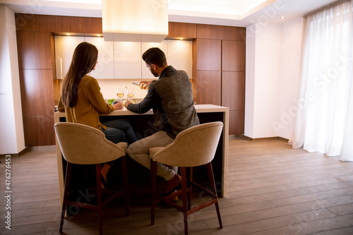 Young couple sitting in the...