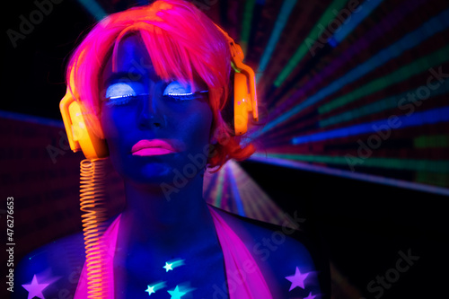 Vászonkép Female dancer in glow UV costume