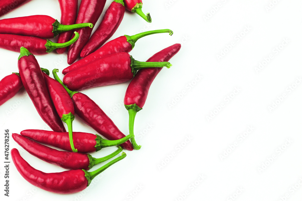 Red chili peppers isolated on white background. Pile of hot peppers Red chili peppers isolated on white background. Pile of hot peppers