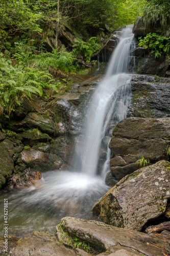 waterfall and flowing water in a mountain stream