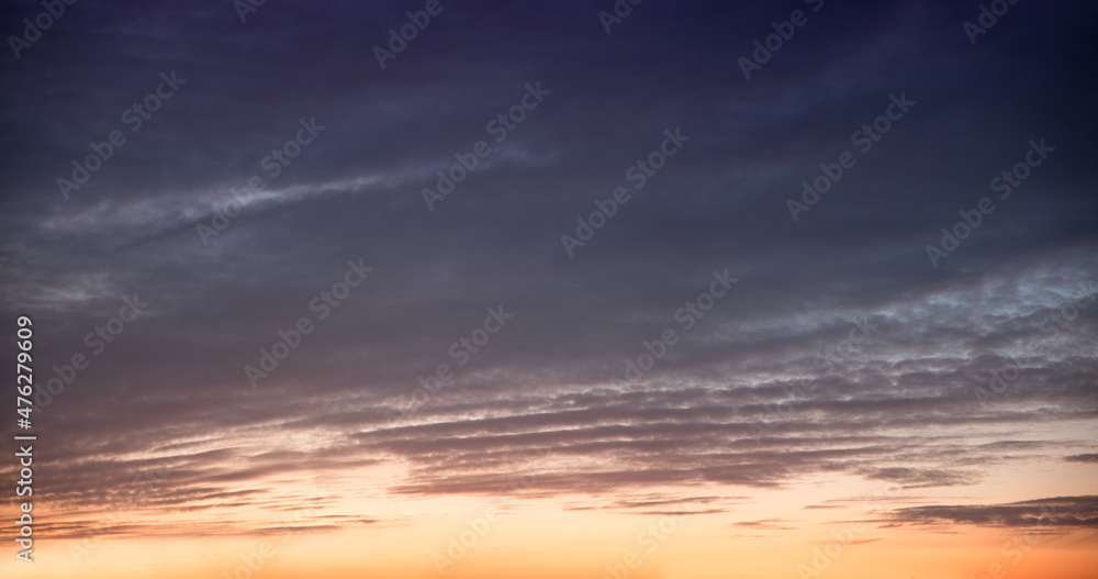 sky panorama at sunset, grey clouds above and orange afterglow below
