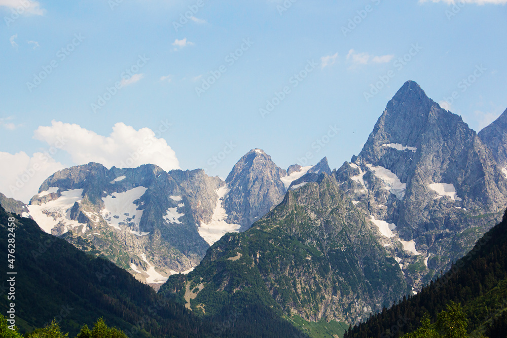 The Caucasus Mountains. Mountain peaks in summer. The Caucasus Mountains. Mountain peaks in summer.