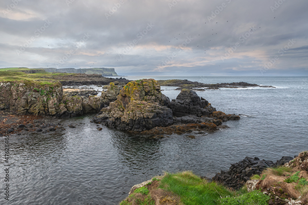 Panoramic sea landscape, the rocky coast on Dunseverick Harbour  on Causeway Road, Bushmills, Co Antrim, Northern Ireland.