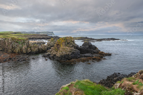 Panoramic sea landscape, the rocky coast on Dunseverick Harbour on Causeway Road, Bushmills, Co Antrim, Northern Ireland.