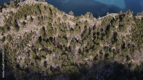 Wallpaper Mural Flying over a coniferous forest, a high cliff and a beautiful mountain lake. Irganai reservoir, Republic of Dagestan, Russia. Torontodigital.ca