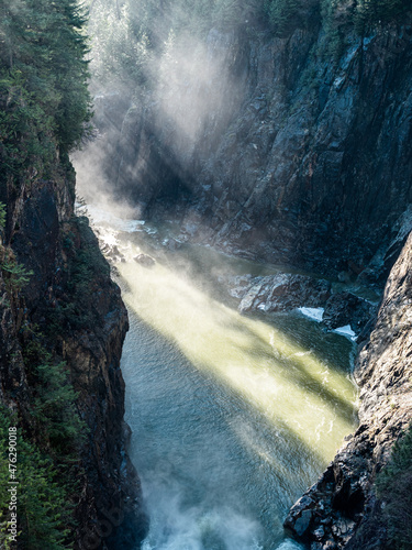 waterfall in the mountains with Tyndall effect