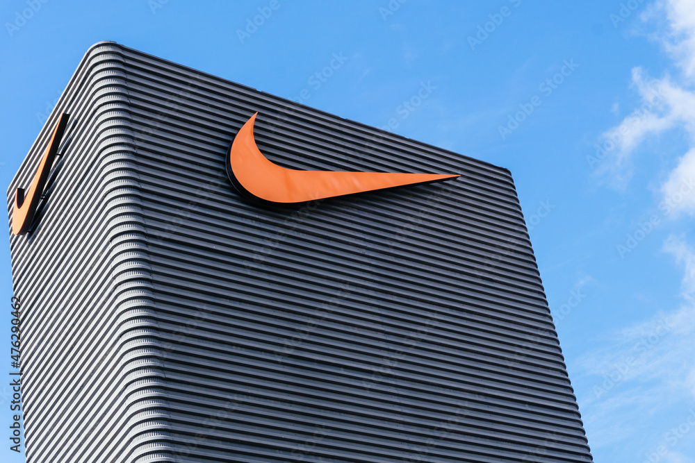 Badalona, Barcelona, Spain - February 28, 2021. Sign on the facade of Nike,  an American multinational company dedicated to the design and manufacture  of sports equipment Stock Photo | Adobe Stock