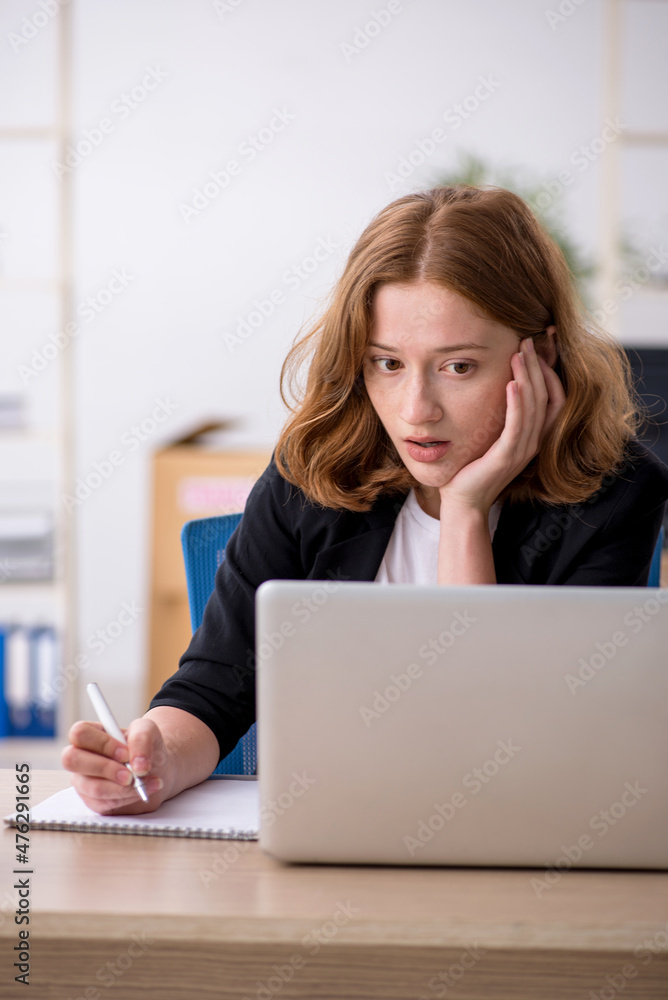 Young woman working in box delivery service Young woman working in box delivery service