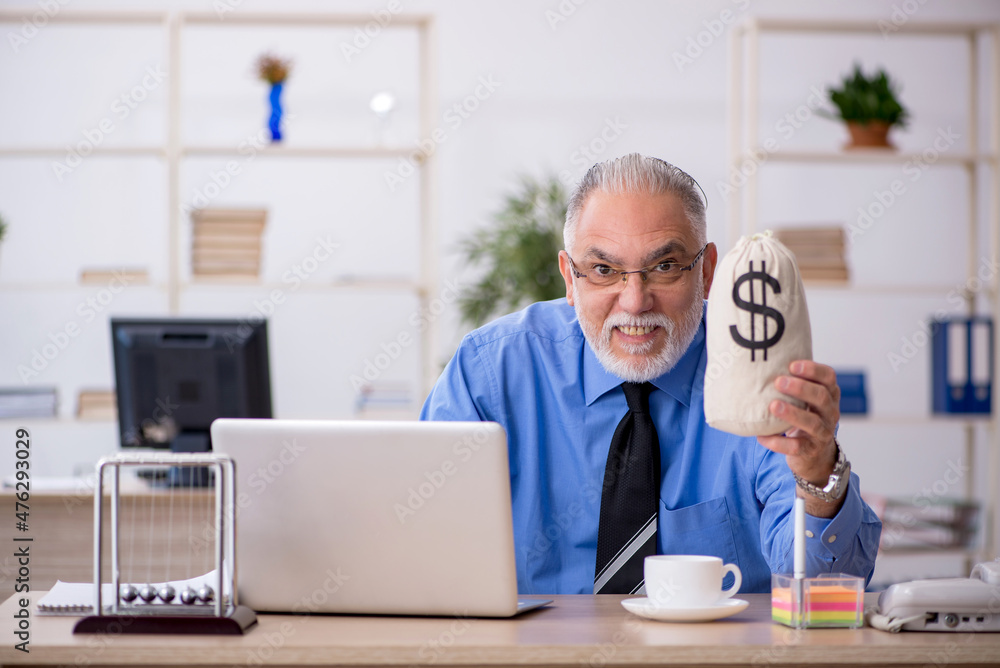 Old male employee in remuneration concept Old male employee in remuneration concept