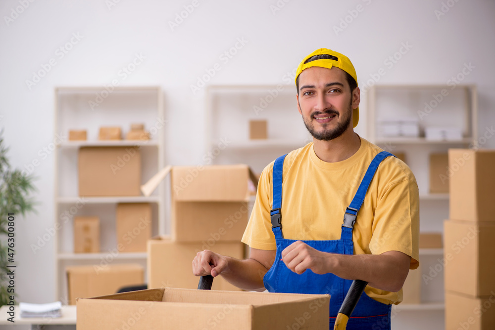 Young male contractor doing home relocation Young male contractor doing home relocation