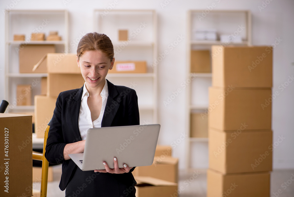 Young female professional mover doing home relocation Young female professional mover doing home relocation