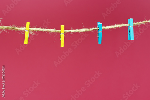 clothespins hanging from a rope