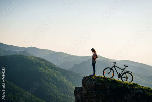 A trip by bike in mountain on the sunset. russia - sep, 2019 Fotobehang