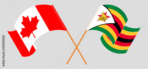 Crossed and waving flags of Canada and Zimbabwe