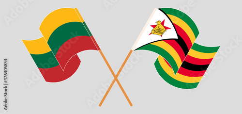 Crossed and waving flags of Lithuania and Zimbabwe