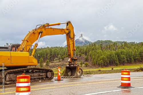 фотографія Chimney Rock National Monument, in Colorado USA with large backhoe working on hi