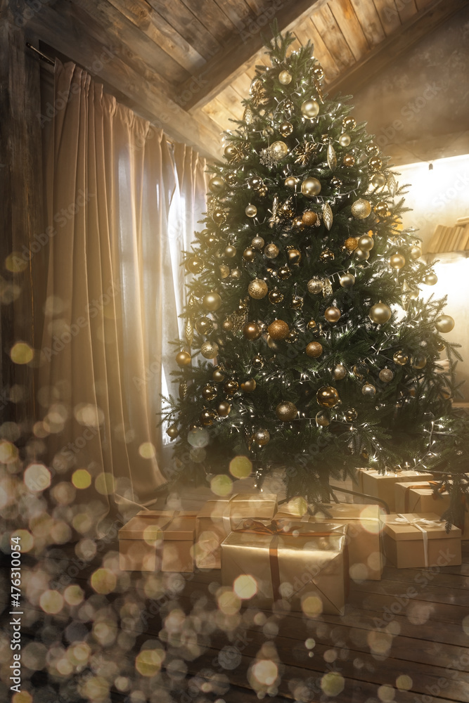 Beautifully decorated and illuminated Christmas tree with many presents under it in wooden rustic interior. Golden decoration and bokeh. Vintage toning.
