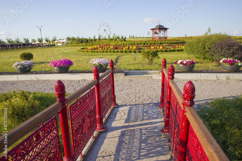 Landscape with oriental pavilion  green meadow and blue sky in the park