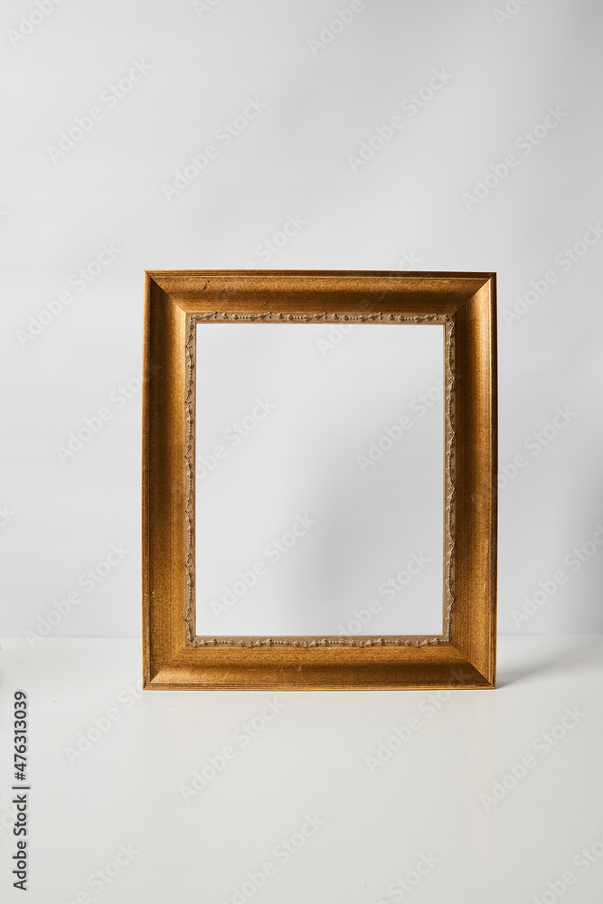 Gold picture frame on a white background Gold picture frame on a white background