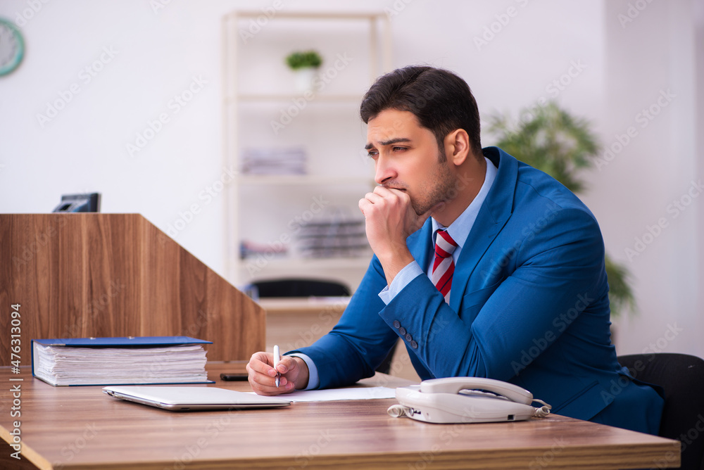 Young businessman employee working in the office Young businessman employee working in the office