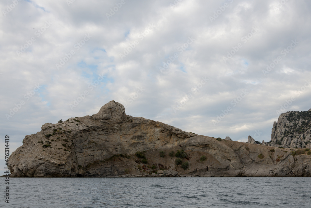 Fototapeta premium Crimean Black Sea coast, landscape sea, mountains and sky, the concept of travel and tourism on the Crimean peninsula
