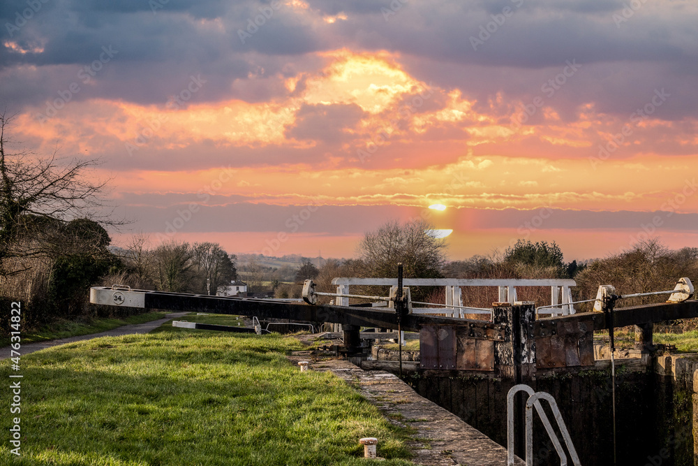 sunset over the Caen Hill flight of the Kennet and Avon canal in Wiltshire