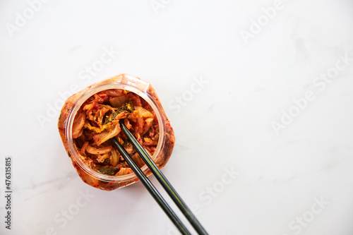 Top view of kimchi served in a glass bowl