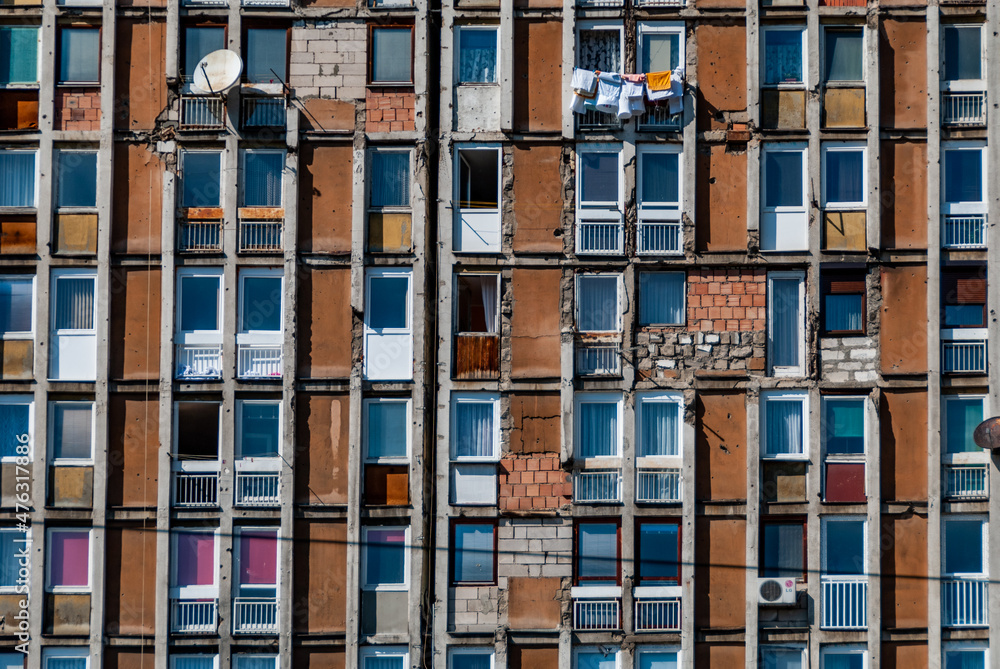 Sarajevo, Bosnia-Hercegovina, 12 September 2015. Exterior view of a run-down apartment block on Bulevar Meše Selimovića still bearing the scars of the war and siege of Sarajevo.