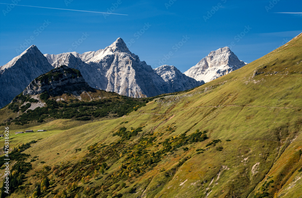 Autumn atmosphere in the afternoon sun in the Karwendel Mountains in the Austrian Alps with view to the Teufelskopf, Gumpenspitze and Lalidererwände at the background