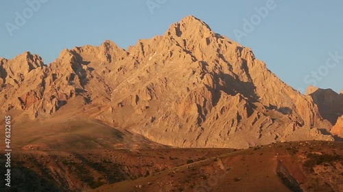 Mount Demirkazik at sunset in Nigde, Turkey. Mount Demirkazik is the most famous mountain in Aladaglar. photo